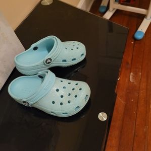 Girls Crocs Size 11. One pair is White and One pair is Aqua